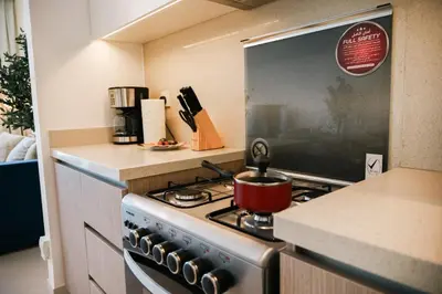 a kitchen with a stove with a pot on it at HAVN - High Floor 2 bedroom in The Grand in Dubai