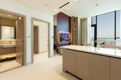 an office lobby with a bar and a tv at High-Floor Apartment with Balcony Pool in Dubai