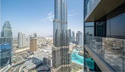 a view of a city with a tall skyscraper at Prestige 3Bed with Full Iconic Burj Khalifa Views in Dubai