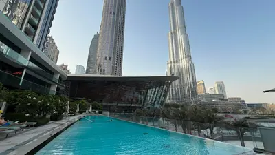 a large swimming pool in a city with tall buildings at Burj Khalifa Front Ultra Luxe Designer Residence in Dubai