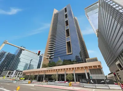a tall building on a city street with a traffic light at Luxury High-Floor Suite Museum of the Future View in Dubai