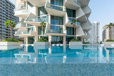 a building with a pool in front of it at Refined Apartment with Private Balcony Pool in Dubai