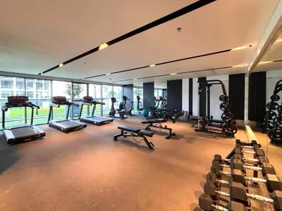 a gym with several treadmills and machines in a room at High-Floor 2BR with Vibrant Street Views and Effortless Drive Access to Downtown Hotspots, Nobles Tower, Business Bay by Deluxe Holiday Homes in Dubai