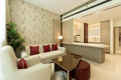 a living room with a couch and a table at Luxury Apartment with Private Pool in JVC in Dubai