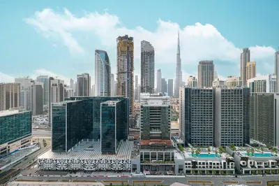 a view of a city with many tall buildings at Designer 2BR with Burj View 5 Min to Dubai Mall in Dubai