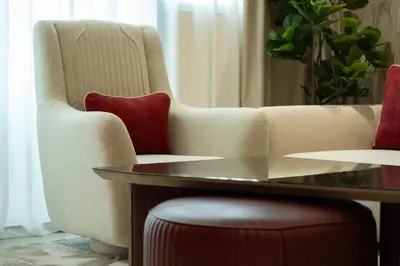 a living room with a couch and a table at Luxury City Apartment with Private Pool in Dubai