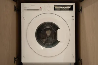 a white washing machine in a room at Luxury City Apartment with Private Pool in Dubai