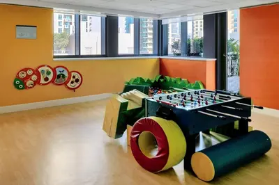 a play room with a lego table and a chessboard at Elegant studio balcony boulevard view in Dubai