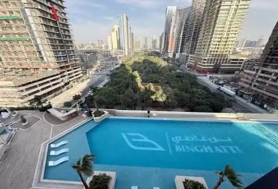 a swimming pool in a city with tall buildings at Sophisticated Apartment with Private Pool in Dubai