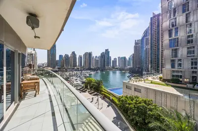 a balcony with a view of a river and buildings at Elite Escapes - Glamorous Damac Heights - 2 BR in Dubai