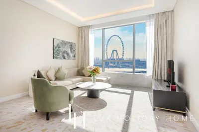 a living room with a couch and a table at LUX Iconic Views at The Palm Tower Suite 7 in Dubai