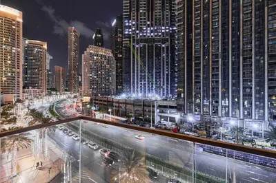 a view of a city at night with traffic at Premium 2BR Residence in Downtown Dubai in Dubai