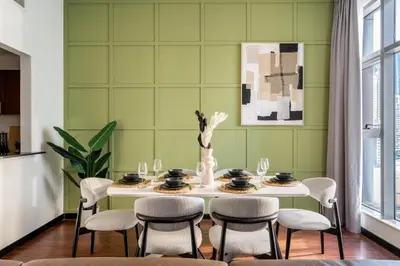 a dining room with a table and chairs at GuestReady - 1BR | JLT Apt near Metro Station in Dubai