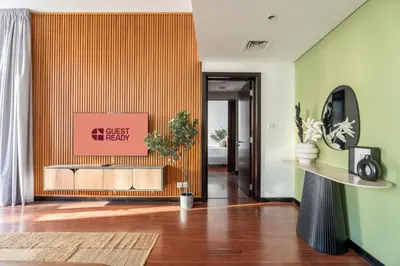 a lobby with a guest exit sign on the wall at GuestReady - 1BR | JLT Apt near Metro Station in Dubai
