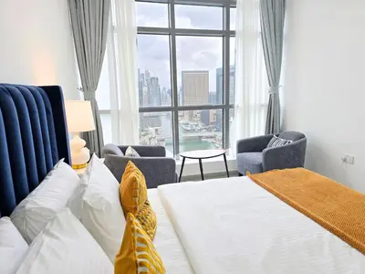a hotel room with a bed and a large window at Marina Breeze - Serene Yacht Views near Ain Dubai 3 BR Apartment in Dubai