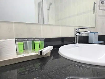 a bathroom with a sink and a mirror at Marina Breeze - Serene Yacht Views near Ain Dubai 3 BR Apartment in Dubai