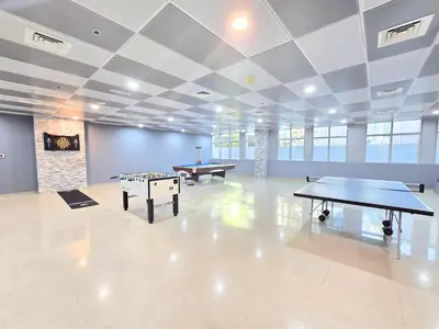 a large room with two ping pong tables in it at Marina Breeze - Serene Yacht Views near Ain Dubai 3 BR Apartment in Dubai