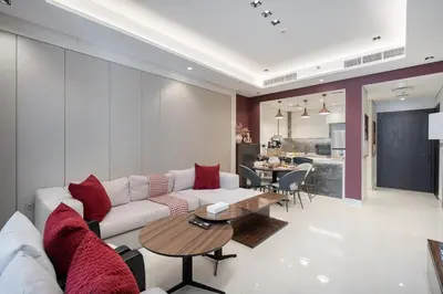 a living room with a couch and a table at Stylish 1BHK Retreat at Nobles Tower, by Czechin in Dubai