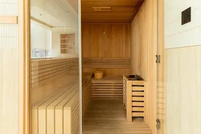 a sauna with wood paneling and a wooden floor at Premium Apartment with Private Balcony Pool in Dubai