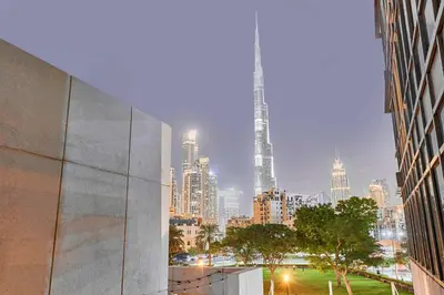a view of a city skyline with a tall skyscraper at Greenview 2BHK Stay in Dubai