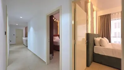 a bedroom with a bed and a bathroom with a mirror at Elan Rimal Bahar Suites, 1min walk to the Sea! Prime location JBR Beach Front in Dubai
