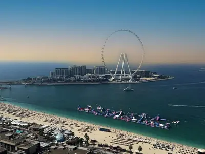 an aerial view of a beach with a ferris wheel at Festive Winter Stay in JBR - Beach, Marina, Metro in Dubai