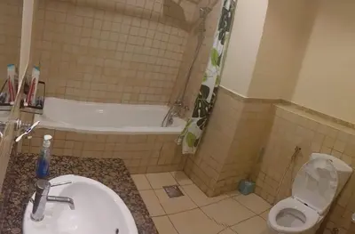 a bathroom with a sink and a tub and a toilet at Festive Winter Stay in JBR - Beach, Marina, Metro in Dubai