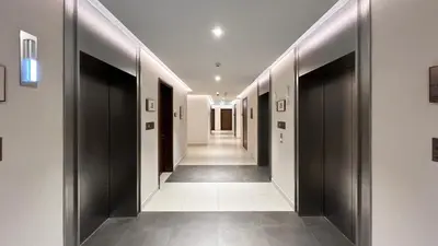 a hallway of a building with black doors at Emaar 52 42! Iconic Sea-View! Dubai Marina in Dubai