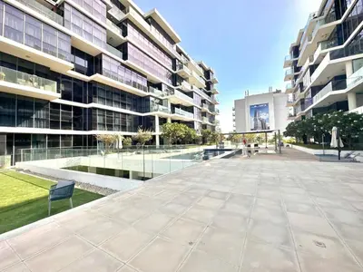 an empty courtyard in front of a building at Warm & Stylish Studio with Balcony in Dubai
