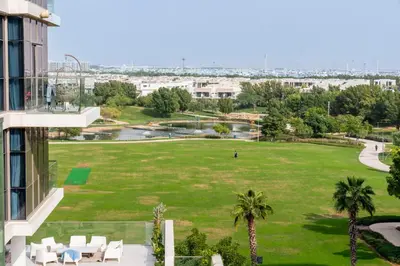 a view of a park from a building at Warm & Stylish Studio with Balcony in Dubai