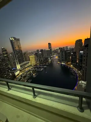 a view of a city with boats in the water at Sky-High Luxury 1BR Best Views of Dubai Marina Emaar 39th Floor in Dubai