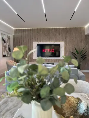 a living room with a tv and a couch at Sky-High Luxury 1BR Best Views of Dubai Marina Emaar 39th Floor in Dubai