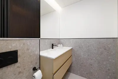 a bathroom with a sink and a mirror at Calm & Stylish 1Bedroom in Hadley Heights JVC in Dubai