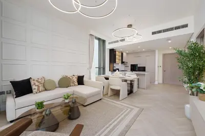 a living room with a couch and a table at Calm & Stylish 1Bedroom in Hadley Heights JVC in Dubai