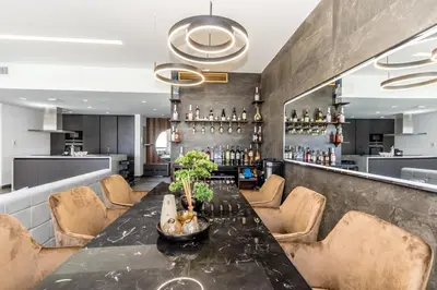 a dining room with a long table and chairs at Luxury 2BR Sea View Jumeirah Beach Residence in Dubai
