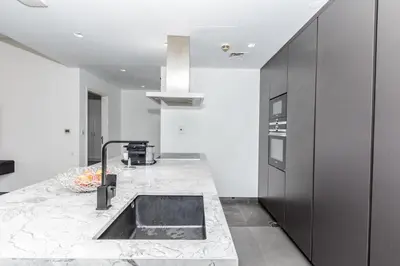 a kitchen with a sink and a counter at Luxury 2BR Sea View Jumeirah Beach Residence in Dubai