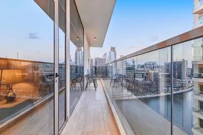 a view from the balcony of a building with glass windows at 2BHK Canal View Stay-Business Bay in Dubai