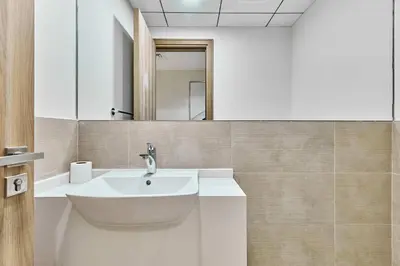 a bathroom with a sink and a mirror at 2BHK Canal View Stay-Business Bay in Dubai
