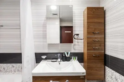 a bathroom with a sink and a mirror at Cozy 1BR Near Metro in Starz Tower 2 in Dubai