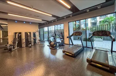 a gym with treadmills and ellipticals in a building at Cozy & Stylish 1BR in Wilton Terraces in Dubai