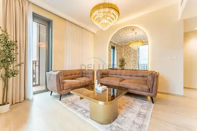 a living room with a couch and a table at Community View, Near Dubai Creek Harbour Marina Walk - Summer at Creek Beach Building 2 by Deluxe Holiday Homes in Dubai