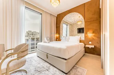 a bedroom with a bed and a large window at Community View, Near Dubai Creek Harbour Marina Walk - Summer at Creek Beach Building 2 by Deluxe Holiday Homes in Dubai