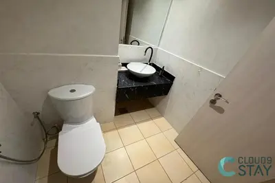 a bathroom with a white toilet and a sink at Cloud 9 - Steps to the Beach Elegant 2BR in JBR in Dubai