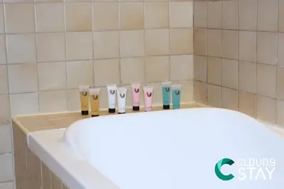 a row of different colored toothbrushes in a bathroom at Cloud 9 - Steps to the Beach Elegant 2BR in JBR in Dubai