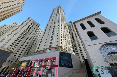 a street with tall buildings in a city at Cloud 9 - Steps to the Beach Elegant 2BR in JBR in Dubai