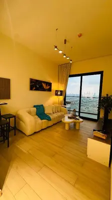 a living room with a couch and a table at Kats in Dubai