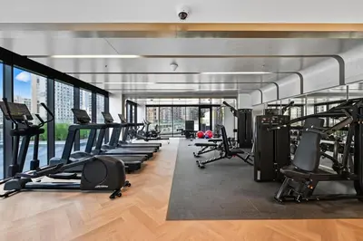 a gym with treadmills and elliptical machines at Zafir Studio in Dubai by beBalmy in Dubai