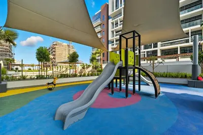 a playground with a slide in a building at Zafir Studio in Dubai by beBalmy in Dubai