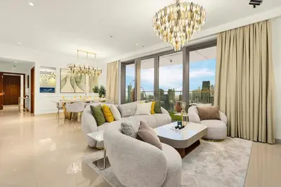 a living room with a couch and a table at Keylid Stunning3BR and Maid connected to Dubai Mall in Dubai