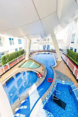 an overhead view of a swimming pool on a cruise ship at Luxury Dubai Studio with Private Pool & Desert Views in Dubai